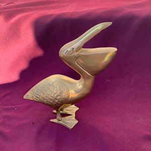 Decorative brass pelican.